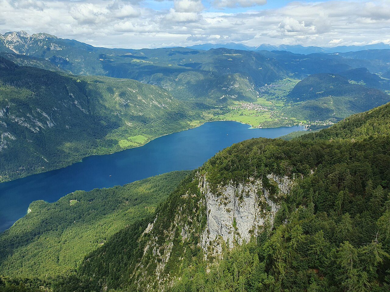 Lake Bohinj and the surrounding mountains seen from a cabin of the Vogel cable car in Slovenia