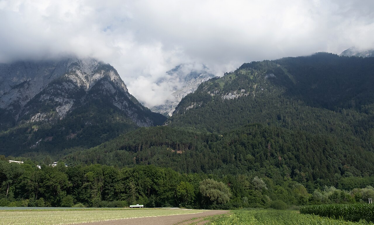 Mountain slopes and the edge of Innsbruck seen from Kranebitter Allee, Austria.