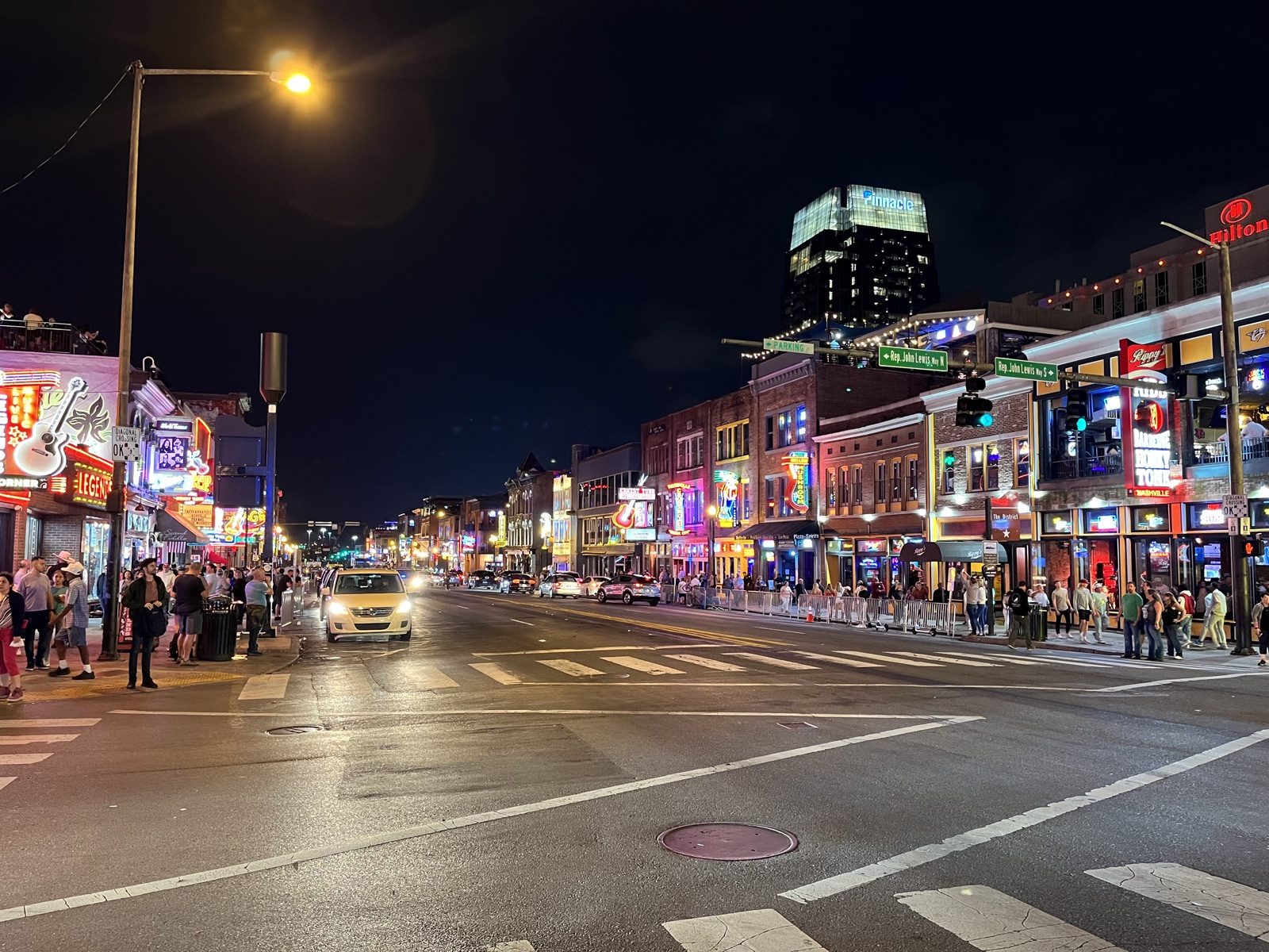 Neon signs of honky-tonk bars light up Lower Broadway in Nashville at night